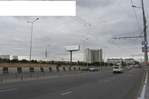 Университетский проспект (2-я Продольная автомагистраль), 105А, напротив ГМ Спортмастер поз.1 В