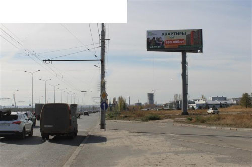 Университетский проспект (2-я Продольная автомагистраль), 105А, напротив ГМ Спортмастер поз.1 А